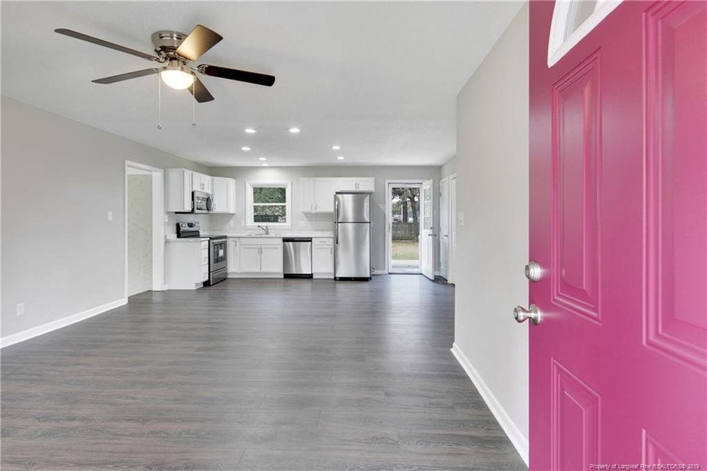 Flooring Installation - gray vinyl floors - Fayetteville M&D Construction with pink door